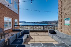 a balcony with benches and a view of the water at Surfboard-Themed Huddleston Studio w/ Beach Access in Huddleston