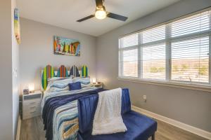 a bedroom with a bed and a ceiling fan at Surfboard-Themed Huddleston Studio w/ Beach Access in Huddleston +26 photos