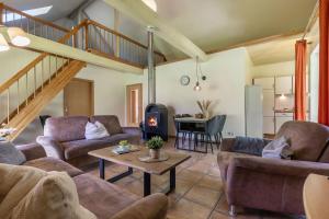 a living room with two couches and a table at Ferienhaus 2 in Fehmarn