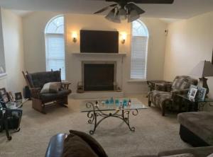 a living room with a couch and a tv at Caribbean Deck Estate in Effort
