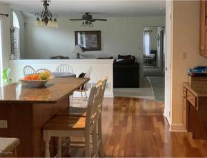 a kitchen with a table with a bowl of fruit on it at Caribbean Deck Estate in Effort