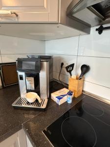 a coffee maker on a counter in a kitchen at Schelder Zimmer in Dillenburg