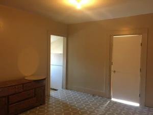 an empty room with a bed and a closet at 424 E Levee Sreet #1 in Brownsville