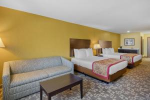 a hotel room with two beds and a couch at Best Western Blackfoot Inn in Blackfoot +26 photos