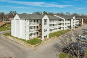 an aerial view of a large white building at Birch Hill Suites Kansas City - Independence in Independence