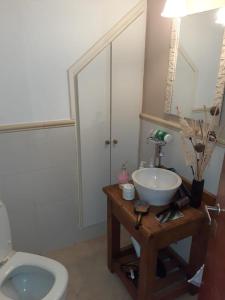 a bathroom with a sink and a toilet at MyM in Costa Azul