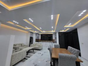 a conference room with a table and chairs and a tv at Ethiopian dream in Addis Ababa