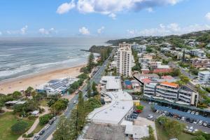 an aerial view of a beach and buildings at Coolum Beach Retreat in Coolum Beach