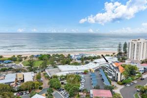 an aerial view of a city and the beach at Coolum Beach Retreat in Coolum Beach +15 photos