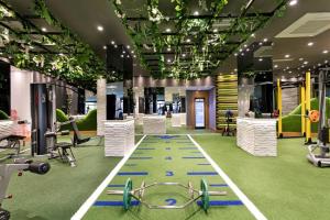 a gym with exercise equipment in a building at Limak Arcadia Sport Resort Belek in Belek