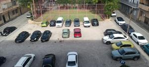 a bunch of cars parked in a parking lot at Apartamento Libertad in Elda