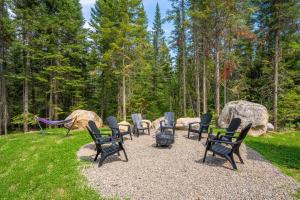 a group of chairs sitting around a fire pit at Le Kouzy - Spa, Foosball, Pool table, Game Room in Sainte-Lucie-de-Doncaster