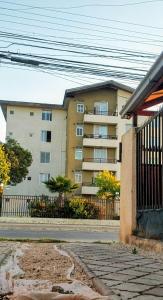 an apartment building in front of a building at La Casa de los Cactus in Coquimbo