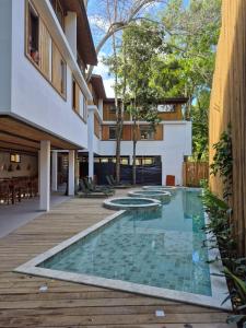 a swimming pool in the middle of a house at Pousada Villa Gûyrá in Trancoso