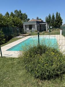 a fence in front of a swimming pool at el sueño in Las Compuertas +23 photos