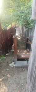 a wooden bench sitting next to a fence at Aztec Adress 133 Beckett Road, mixed shared accommodation in Brisbane