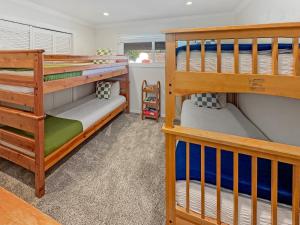 two bunk beds in a room with at F-20 Paradise Pier in Anaheim +41 photos