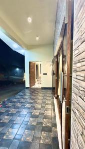a hallway of a house with a tile floor at Aarambh Villa in Sātirje
