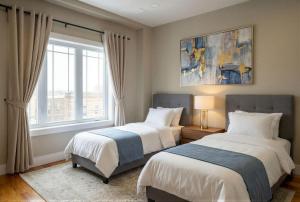 a bedroom with two beds and a window at 4BR5BA Luxury World Cup hub in North Bergen