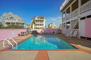 a swimming pool on the side of a house at AV13 Time Away in Avon +17 photos
