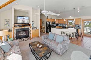 a living room with a couch and a fireplace at AV13 Time Away in Avon