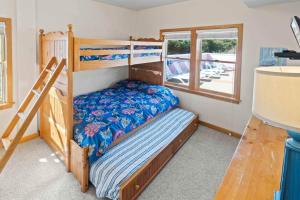 a bedroom with two bunk beds and a window at AV13 Time Away in Avon