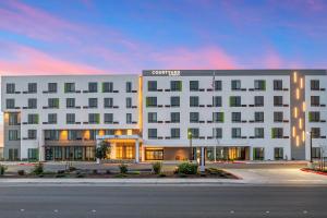a rendering of a hotel with a building at Courtyard by Marriott Woodland in Woodland