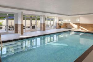 a large swimming pool in a house at Fairfield Inn & Suites Lake City in Lake City