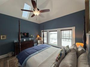 a bedroom with a bed and a ceiling fan at Saltair Inn Waterfront B&B in Bar Harbor