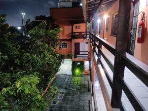 a view from the balcony of a house at night at Pousada Vento Leste in Cabo Frio