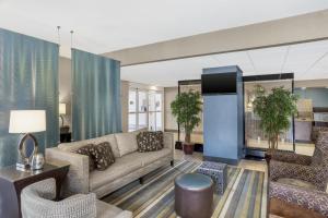 a living room with a couch and chairs at Best Western Plus Tallahassee North Hotel in Tallahassee