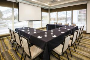 a conference room with a table and chairs and a screen at SpringHill Suites by Marriott Jackson Hole in Jackson +28 photos