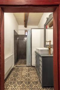 a bathroom with a shower and a sink at NohaTerény in Terény