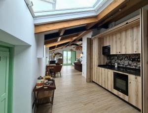 a kitchen with a skylight in the ceiling at El Sueño, Parrita in Barres