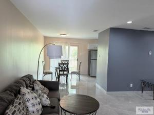 a living room with a couch and a table at 305 Calle Amistosa in Brownsville