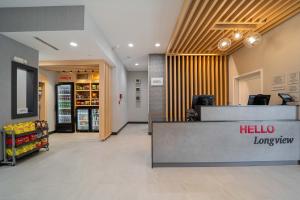 a lobby of a store with a hello lawyer counter at TownePlace Suites Longview in Longview +24 photos