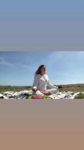 a woman sitting on top of a bed at "BnB NOTO" - Charming Guest House in Noto