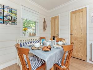 a dining room with a table with food on it at Tanera in Wick