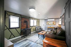 a living room with a couch and a stove at Rose Park Hideaway in Missoula