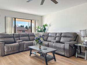 a living room with a couch and a table at Gather Together home in Montrose