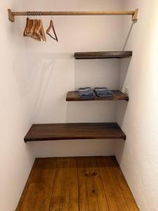 a staircase with wooden shelves in a room at Loft Amplio con Vista Natural en Mazunte in Mazunte