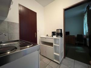 a kitchen with a sink and a counter top at Mariazellerhof Room 014 in Sankt Pölten