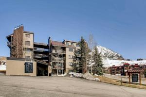 a large building on the side of a street at Crested Butte Mountain Resort Properties by Vail Resorts in Crested Butte