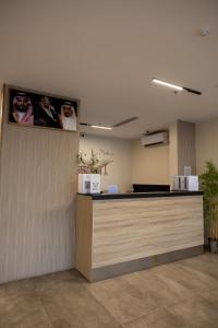 a lobby with a reception desk in a building at فندق ليلة واحدة - One night hotel in Medina