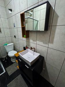 a bathroom with a sink and a toilet at Home Tatuapé in São Paulo +34 photos