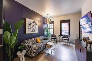 a living room with a couch and chairs at King Bed / Free Parking / BBQ / Fire pit / Arcade in Pittsburgh