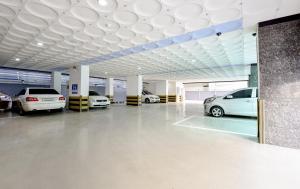 a parking garage with several cars parked in it at S One Hotel in Busan