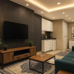 a living room with a flat screen tv on a wall at Nera Otel in Istanbul