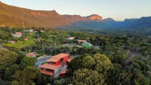 an aerial view of a resort with mountains in the background at Casa Passarinho - Vale do Capão in Vale do Capao
