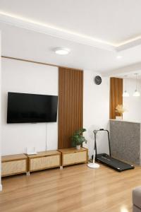 a living room with a flat screen tv on a wall at Homestay in Lipa City in Lipa